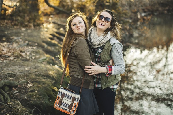 Caucasian woman hugging in park