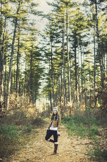 Caucasian woman standing on dirt path