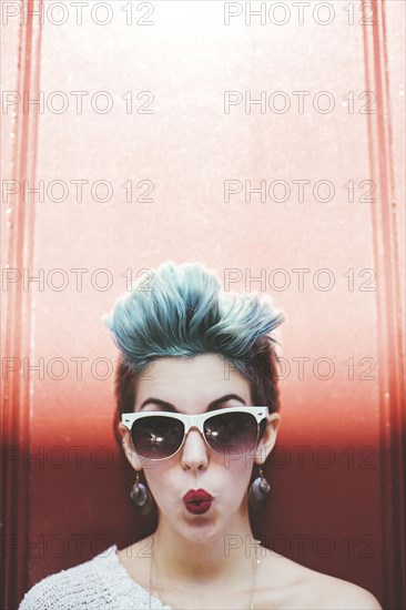 Stylish Caucasian woman with sunglasses and dyed hair