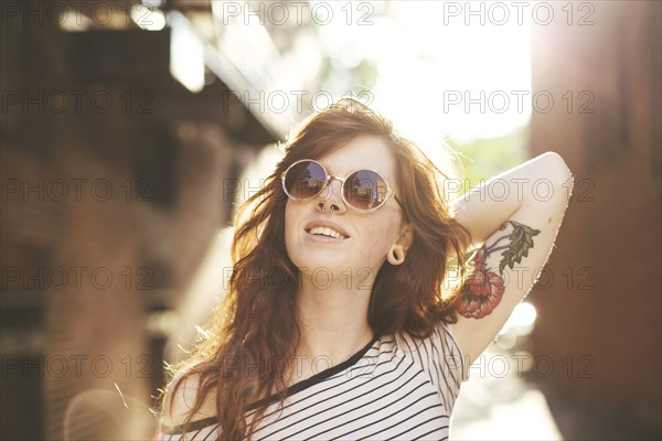 Caucasian woman posing in city