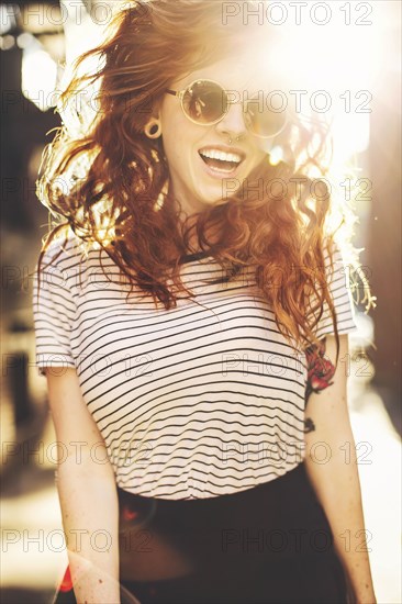 Caucasian woman jumping for joy outdoors