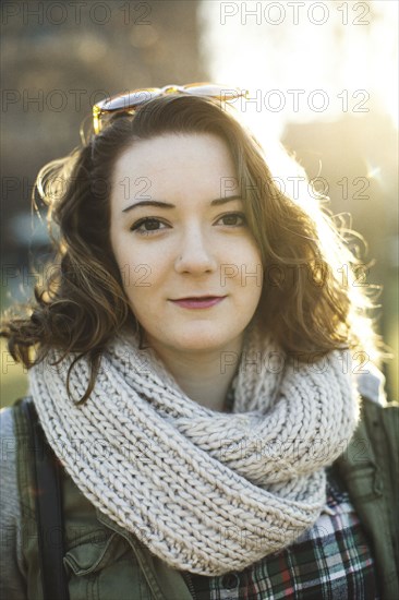 Caucasian woman wearing knitted scarf