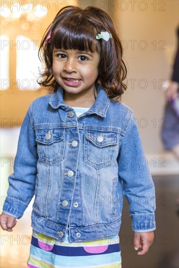 Close up of girl wearing denim jacket