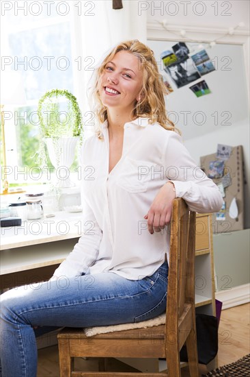 Smiling woman sitting at desk