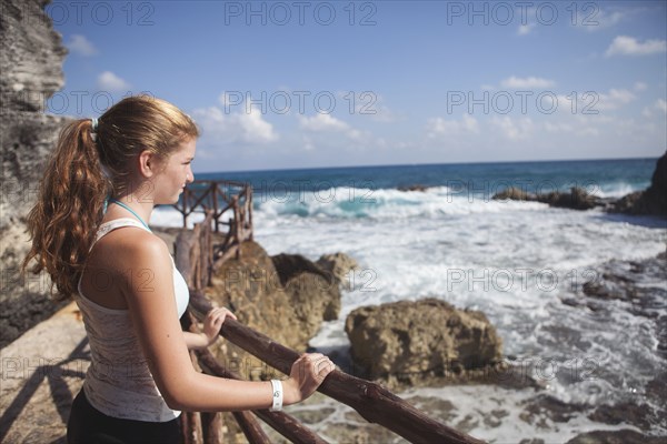 Caucasian teenage girl enjoying ocean view