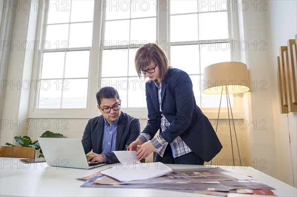 Business people working at desk in office