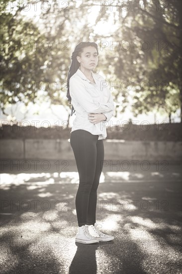 Serious woman standing outdoors