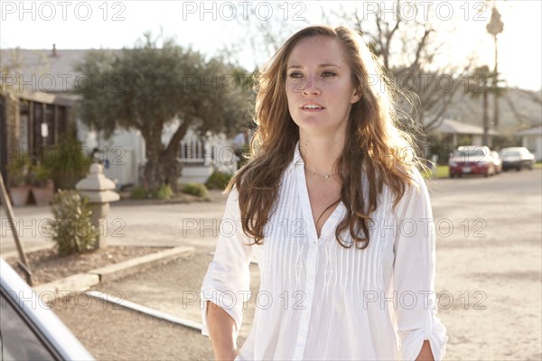 Woman standing in parking lot