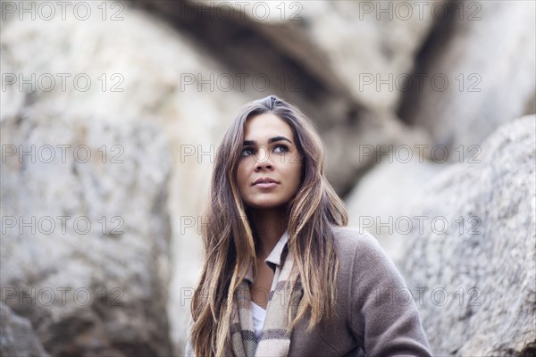 Mixed race woman near rocks