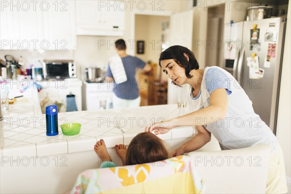 Caucasian family having breakfast in kitchen