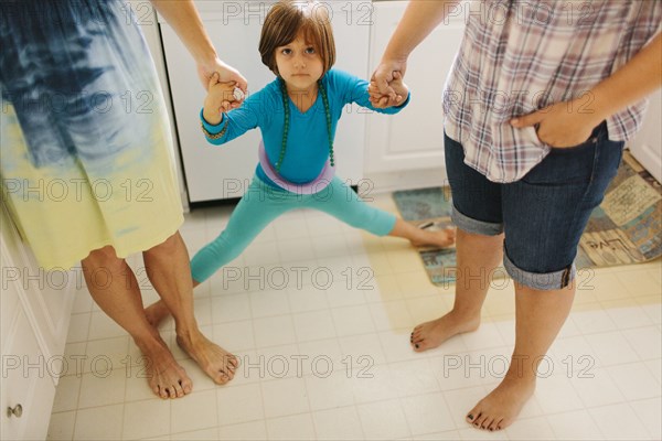 Caucasian family holding hands
