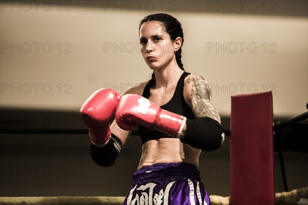 Caucasian boxer standing in ring