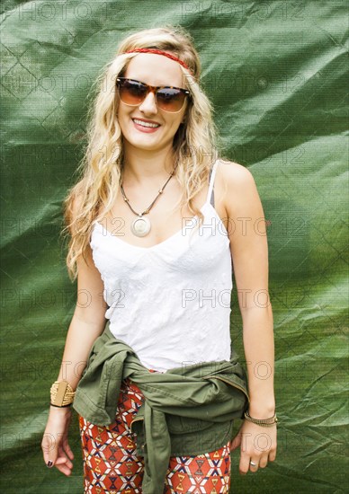 Caucasian woman smiling near tarp