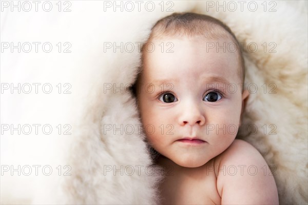 Close up of curious mixed race baby