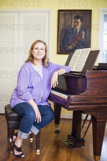 Caucasian musician sitting at piano