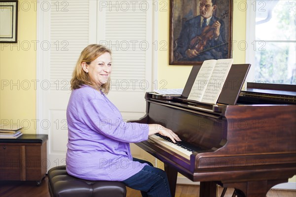 Caucasian musician playing piano