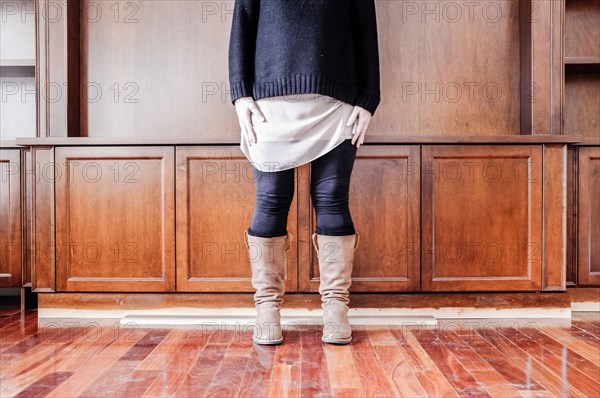 Caucasian woman standing in empty room