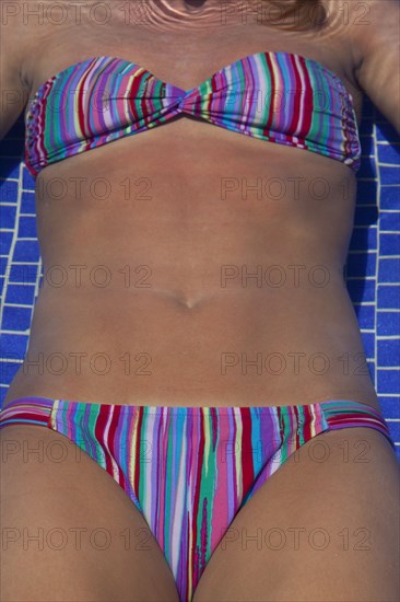 Close up of Caucasian woman sunbathing in bikini