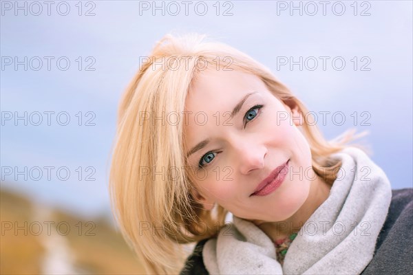 Close up of smiling Caucasian woman tilting head