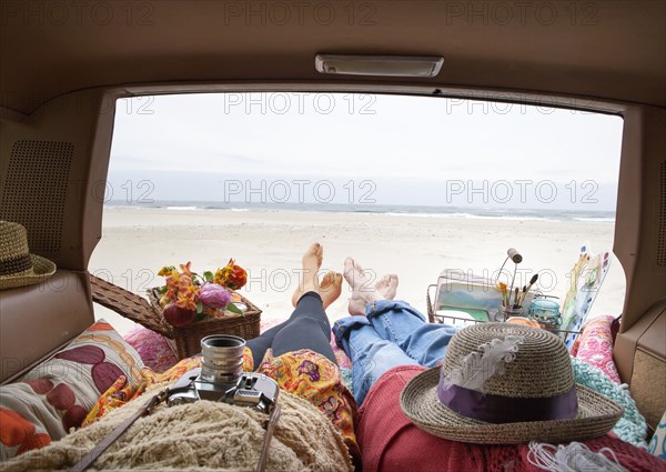 Caucasian mother and daughter relaxing in car