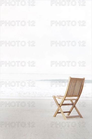 Empty folding chair on beach