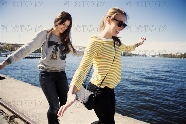Sisters exploring waterfront