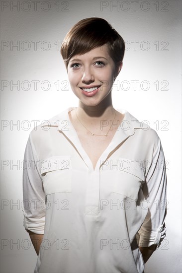 Smiling Caucasian woman wearing white shirt