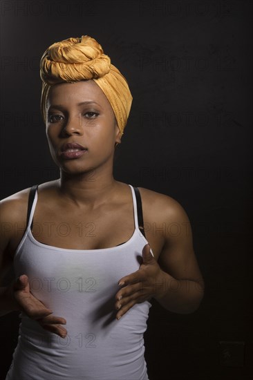 Serious Black woman wearing headwrap