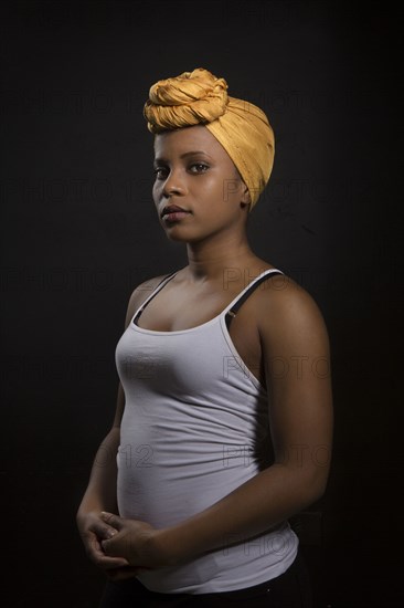 Serious Black woman wearing headwrap
