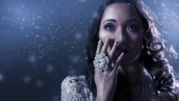 Glamorous Chinese woman covering her face