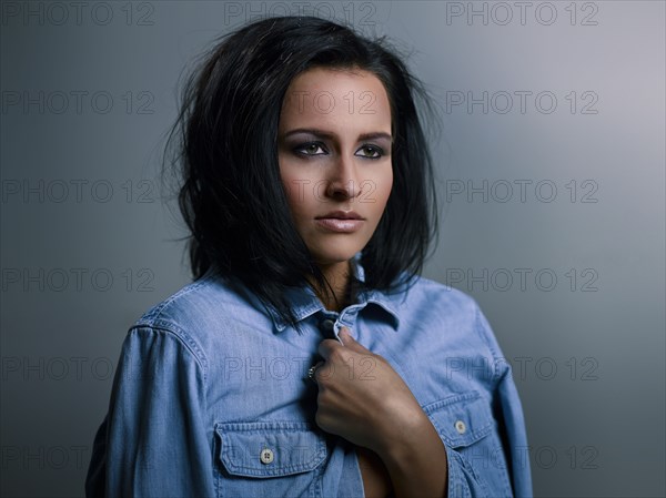 Close up of Hispanic woman with messy hair