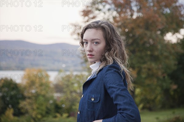 Woman walking outdoors near lake