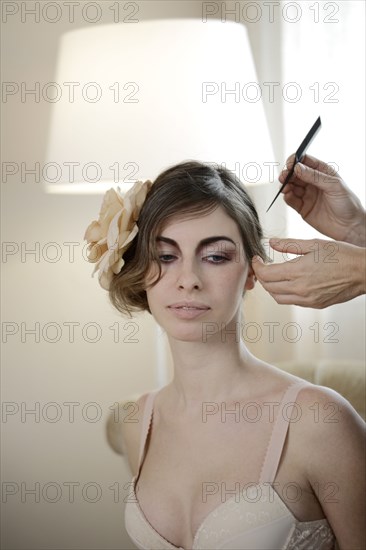 Caucasian woman having hair styled