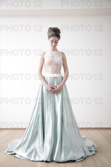 Caucasian bride standing in wedding dress