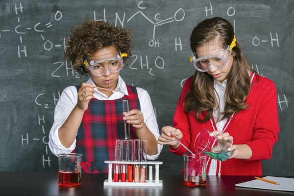 Students doing experiment in science class