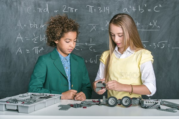 Students building vehicle in science class