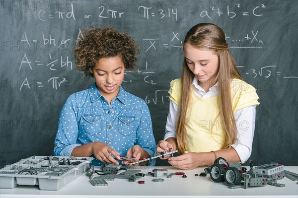 Students building vehicle in science class