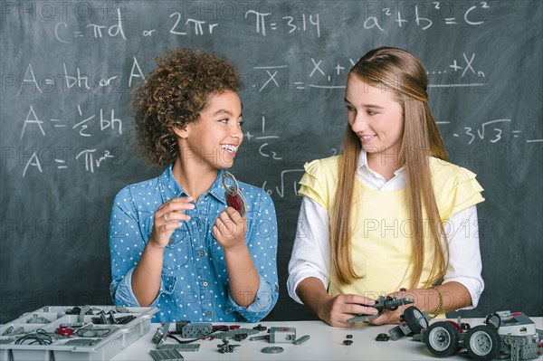 Students building vehicle in science class