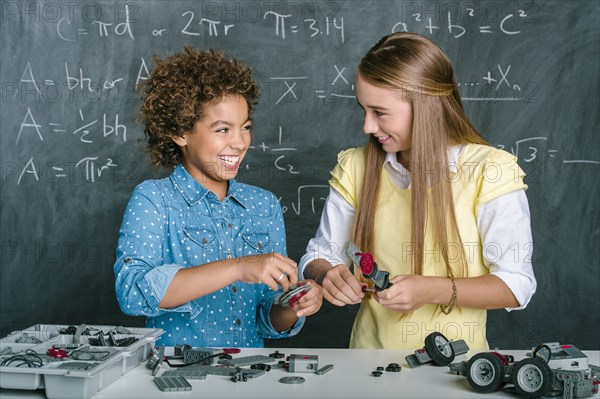 Students building vehicle in science class