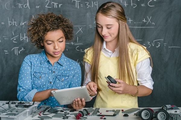 Students building vehicle in science class