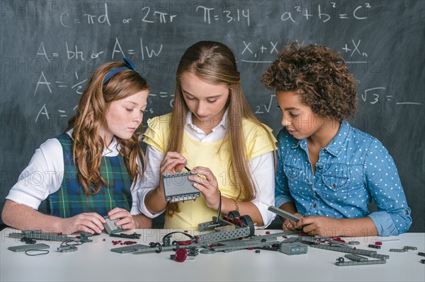 Students building vehicle in science class