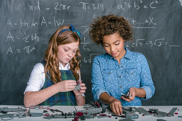 Students building vehicle in science class