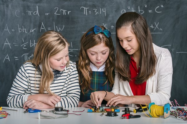 Students building vehicle in science class