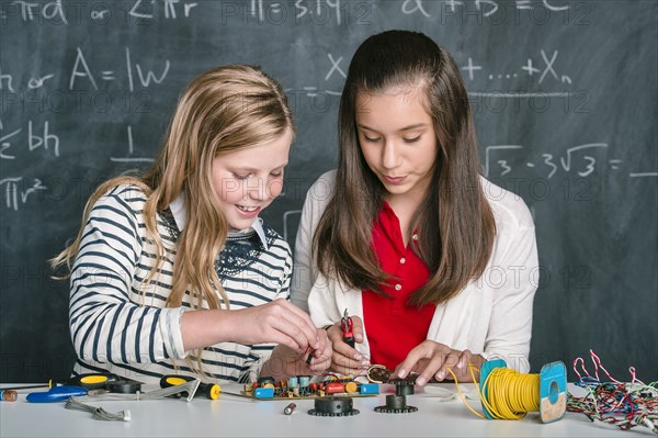 Students building vehicle in science class