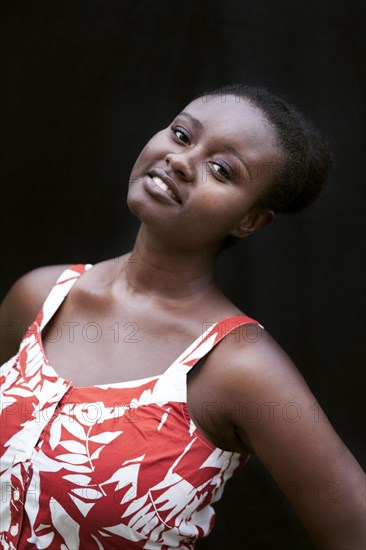 Smiling Black woman wearing sun dress