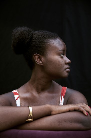 Black woman leaning on forearms