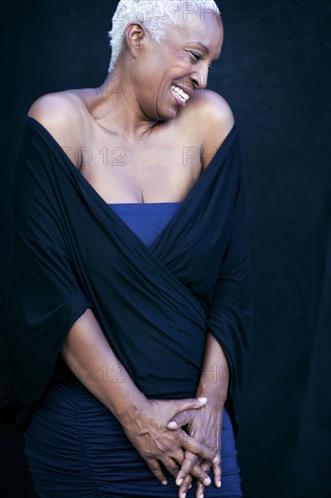 Close up of woman laughing in shawl