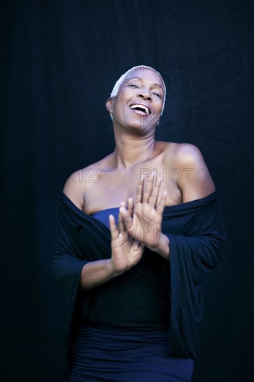 Close up of woman laughing in shawl