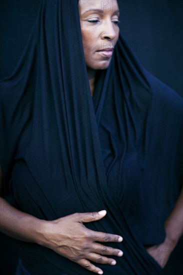 Close up of woman wearing shawl as headscarf