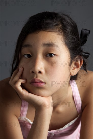 Close up of bored Asian girl